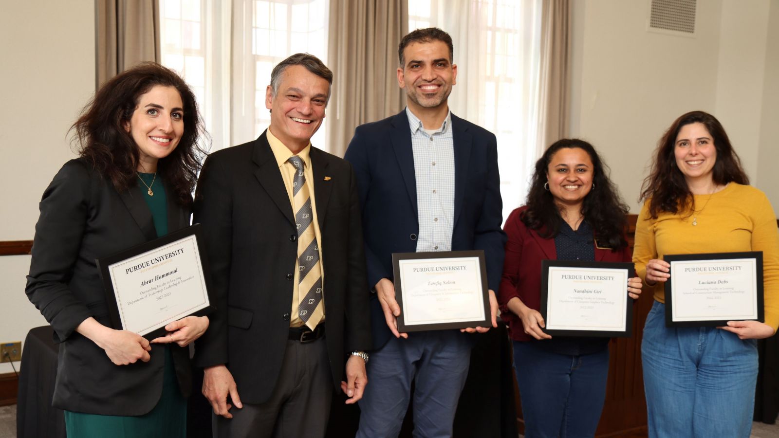 The certificate holders for Outstanding Faculty in Learning (Abrar Hammoud, Tawfiq Salem, Nandhini Giri and Luciana Debs) are pictured alongside Polytechnic Dean Daniel Castro-Lacouture. (Purdue University photo/John O'Malley)
