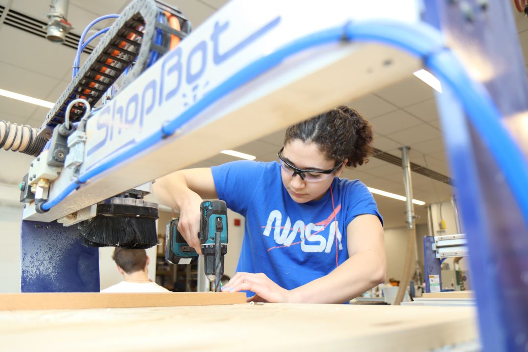 Students working in the Guitar Lab, with oversight by Mark French. (Purdue University photo/John O'Malley)