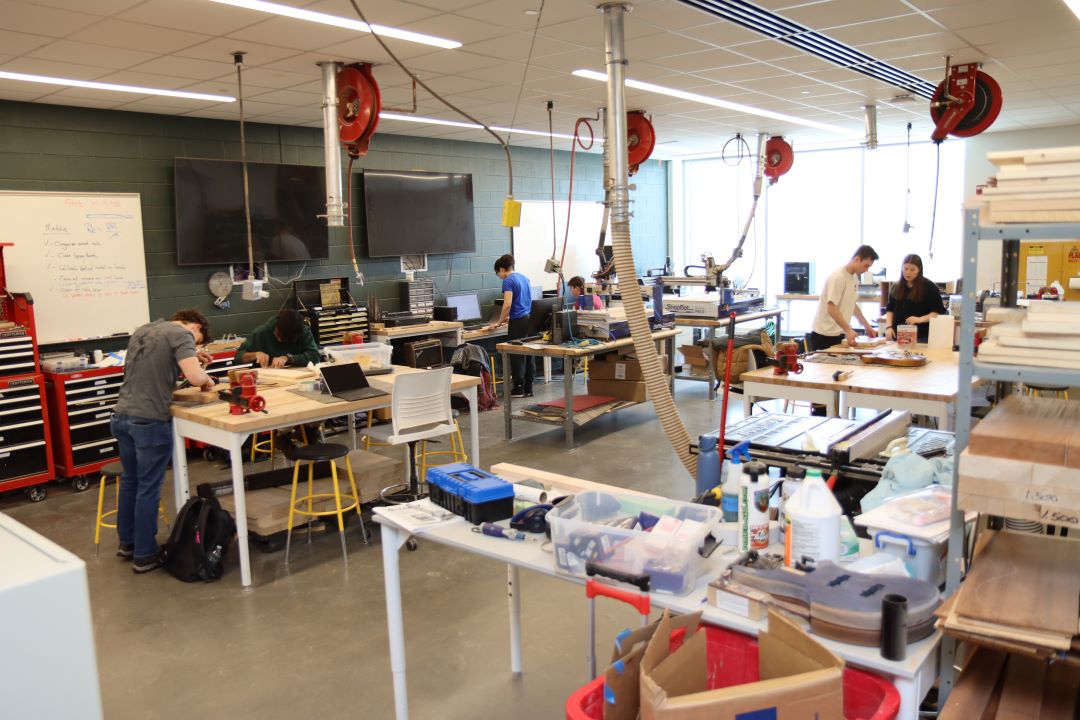 Students working in the Guitar Lab, with oversight by Mark French. (Purdue University photo/John O'Malley)