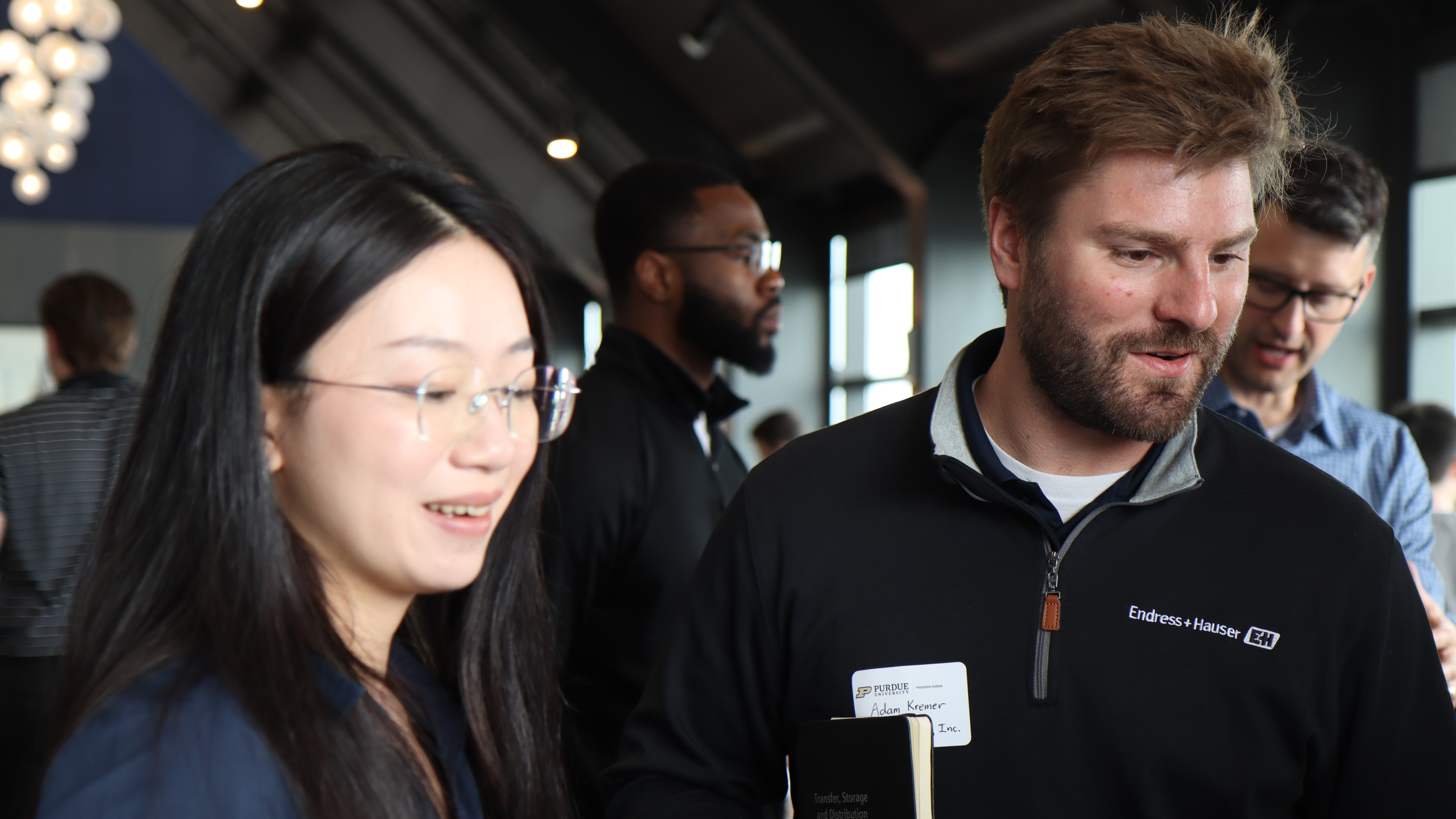 Endress + Hauser representatives speak with Purdue faculty at Research and Industry Day. (Purdue University photo/John O'Malley)