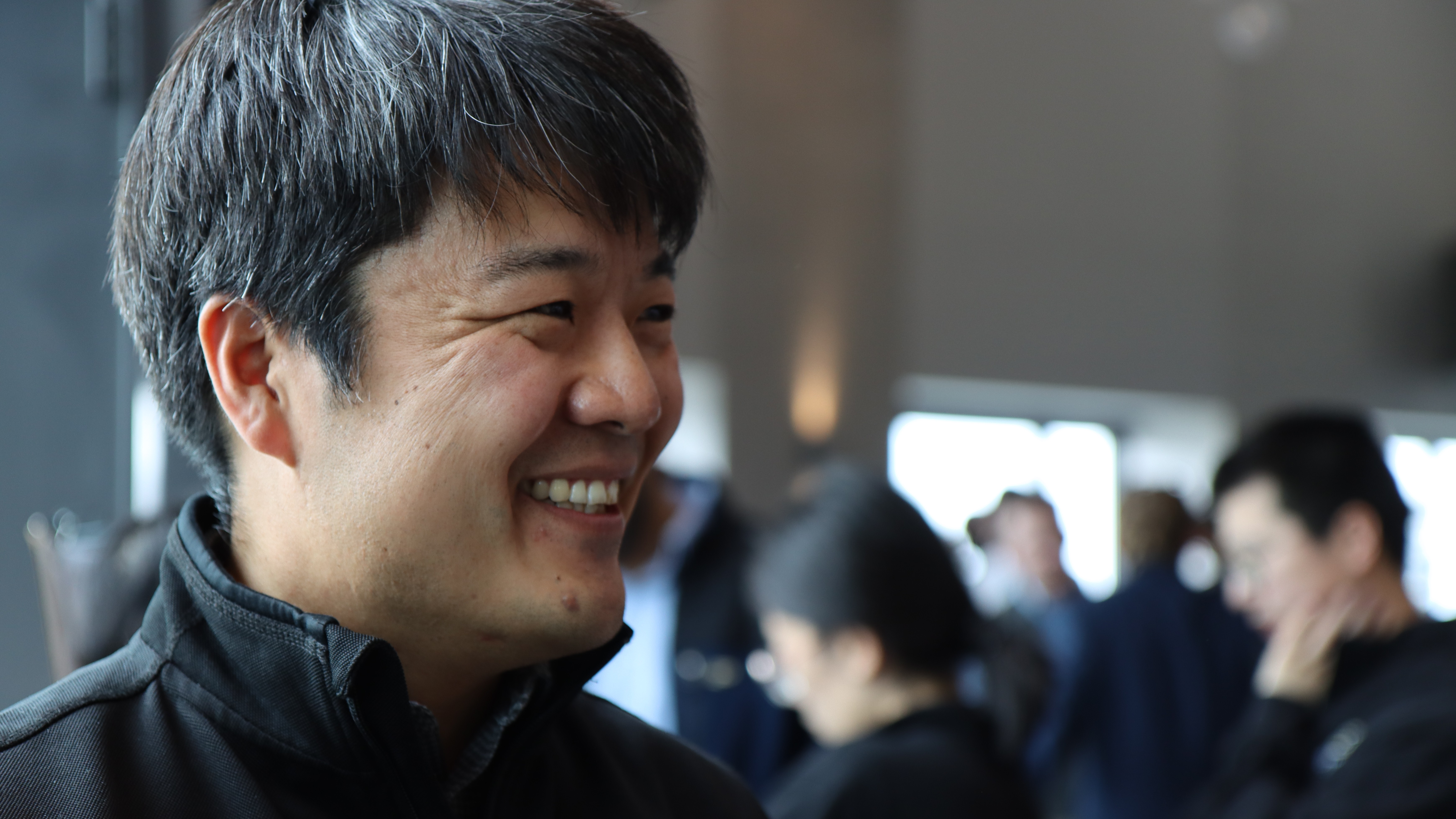 Kyubyung Kang speaks with industry partners at the event.