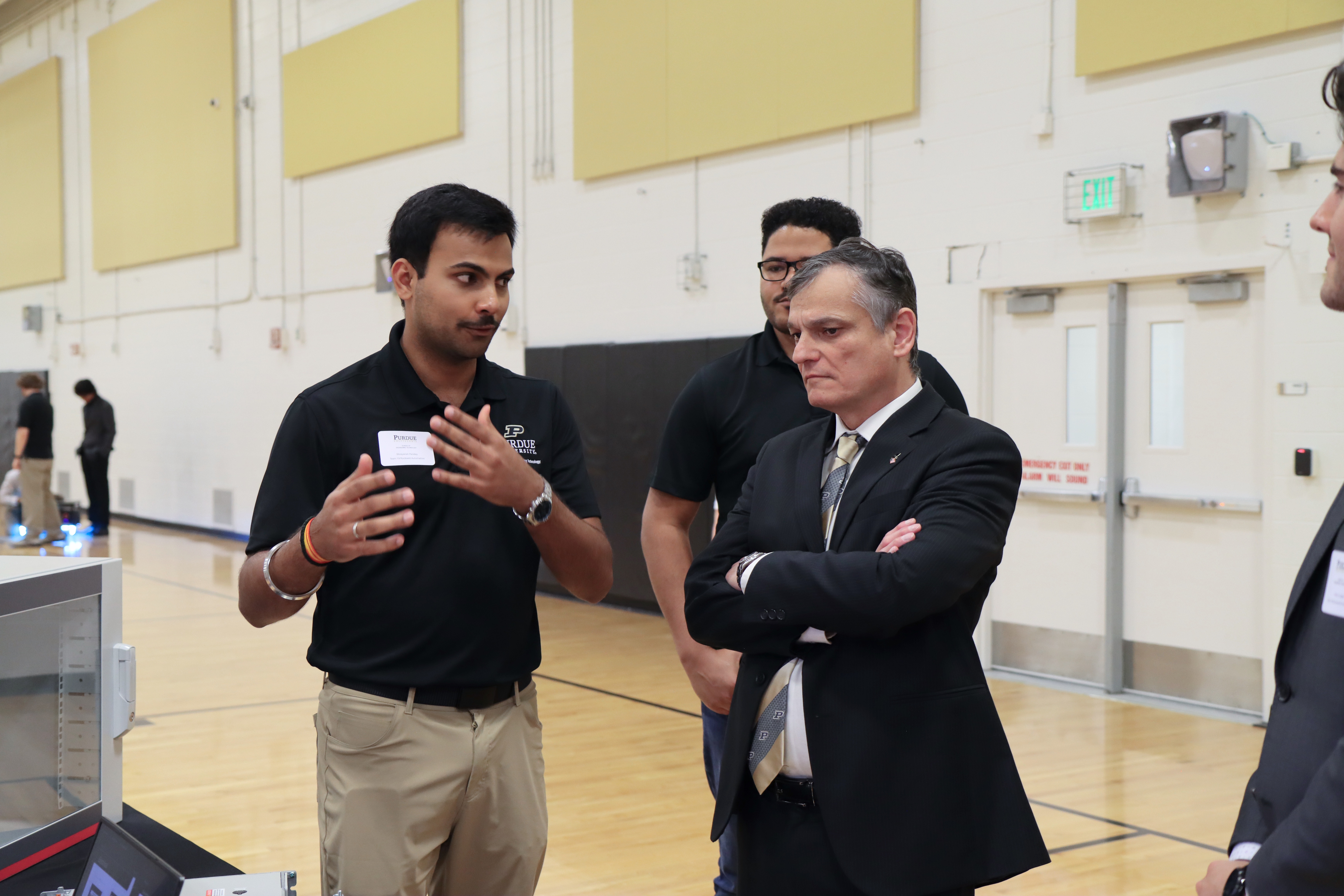 An Engineering Technology student discusses his senior capstone project with Daniel Castro, dean of Purdue Polytechnic, at the Spring 2026 Tech Expo. (Purdue University photo/Zach Rodimel)