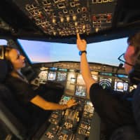 A student pilot and instructor on a flight in Purdue University's Airbus A320 simulator