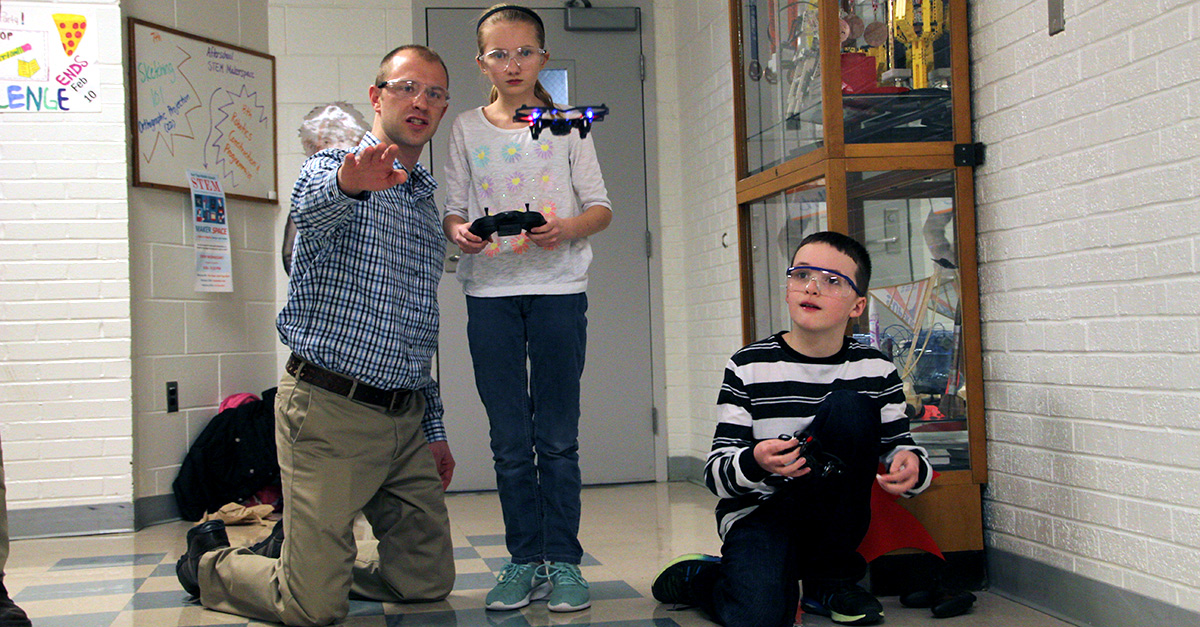 Scott Bartholomew works with students at East Tipp Middle School.