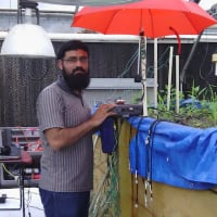 Abdul Salam takes measurements in a test bed at Purdue University to determine the optimum operating frequency for underground antennas.