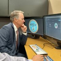 Patrick Harrington, Tippecanoe County prosecutor, views an analysis of digital evidence created by the FileTSAR+ forensic tool. Purdue University researchers improved the original tool by simplifying its functionality and packaging to make FileTSAR+ easier and more cost-effective for law enforcement agencies to set up and maintain. (Purdue Research Foundation photo/Steve Martin)