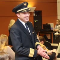 United Airlines Capt. Pete Zabel (BS professional flight 2005) visits with current students during a presentation announcing the United Aviate program’s partnership with Purdue.