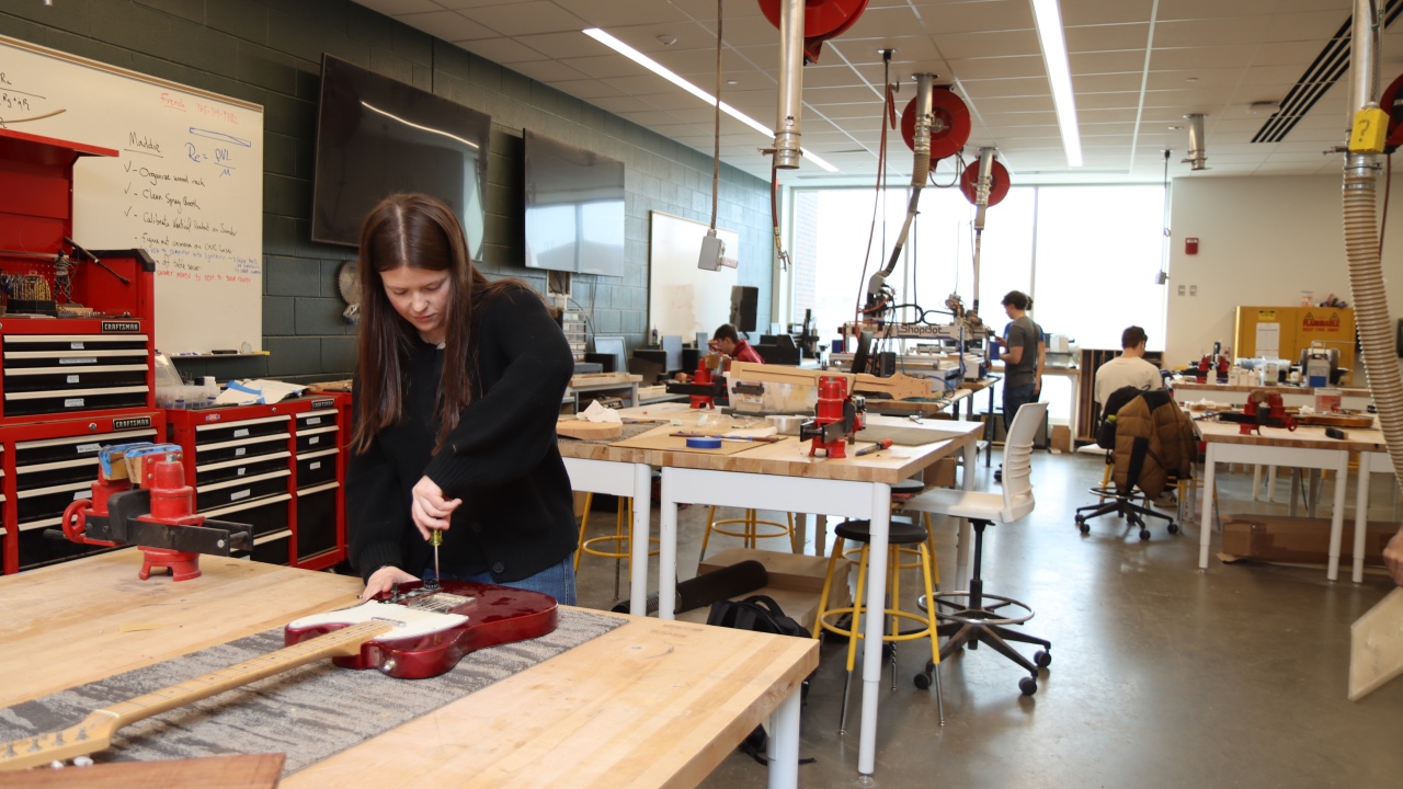 Students working on their instruments in LMBS 4273, or the Guitar Lab. (Purdue University photo/John O'Malley)