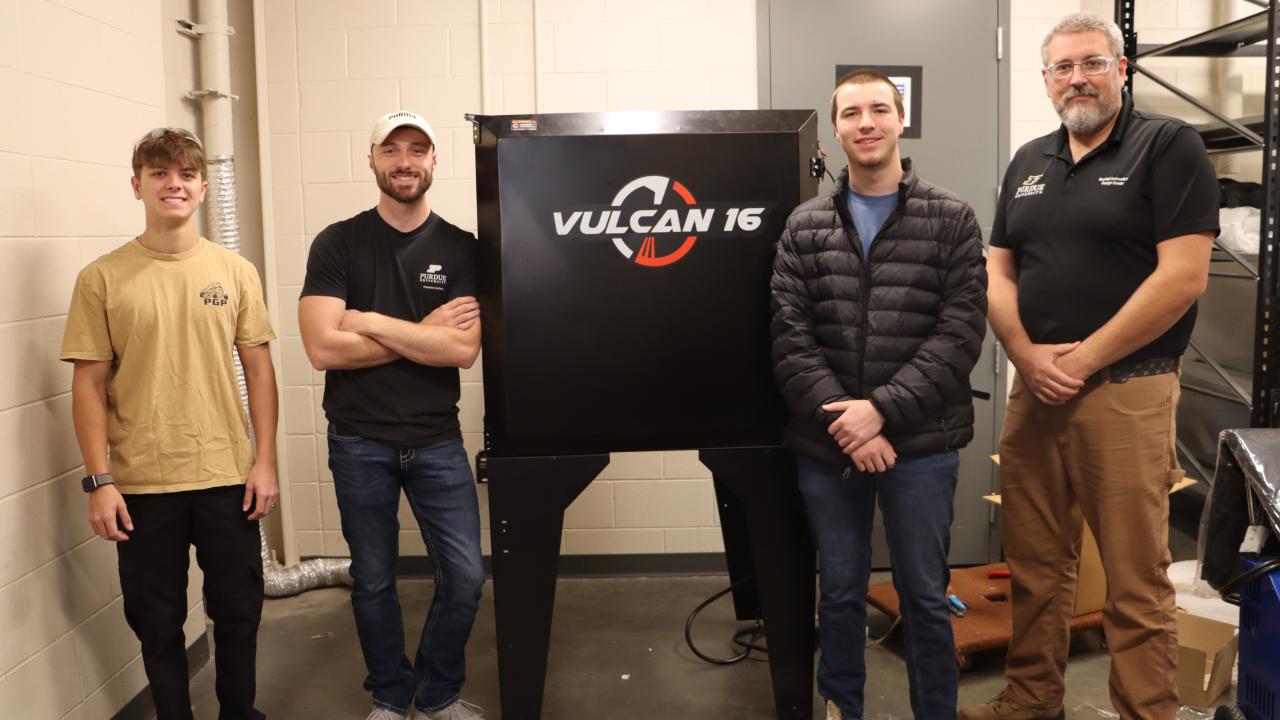 (Left to right) Remy Muessig, Cole Parsons, Kaleb Carson, and Bechtel's director Paul McPherson. (Purdue University photo/Zach Rodimel)