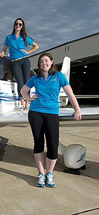 photo of students with airplane