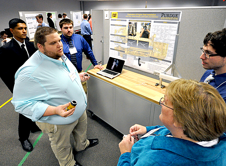 Kevin Eikenberery explains his team's project for Caterpillar.