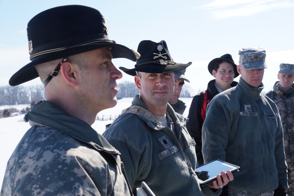 LTC Jason Musteen, LTC Dave Siry, Prof. Nick Sambaluk, Major Greg Jenemann, and a cadet discuss the Battle of Gettysburg.