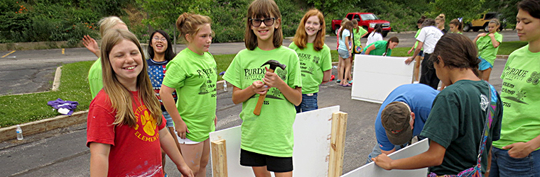 GO STEM participants build their doghouse on the final day.