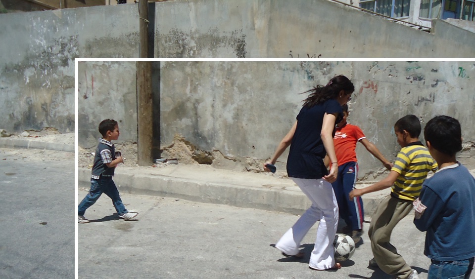 Abrar & neighborhood children play with a ball in the street