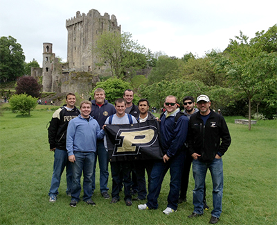 Members of 2014 trip show their Boilermaker pride in front of the Blarney Castle, home of the famed Blarney Stone.