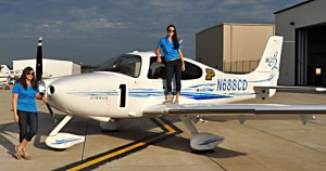 Photo of students with airplane