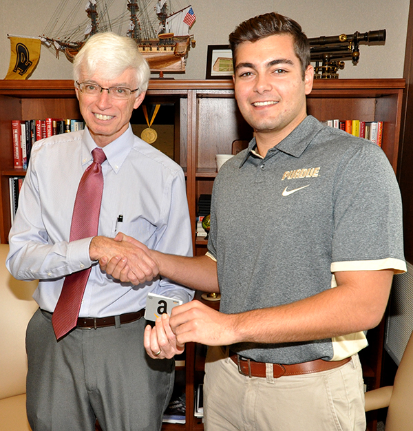 Dean Bertoline congratulates Michael Monaco on this winning entry.