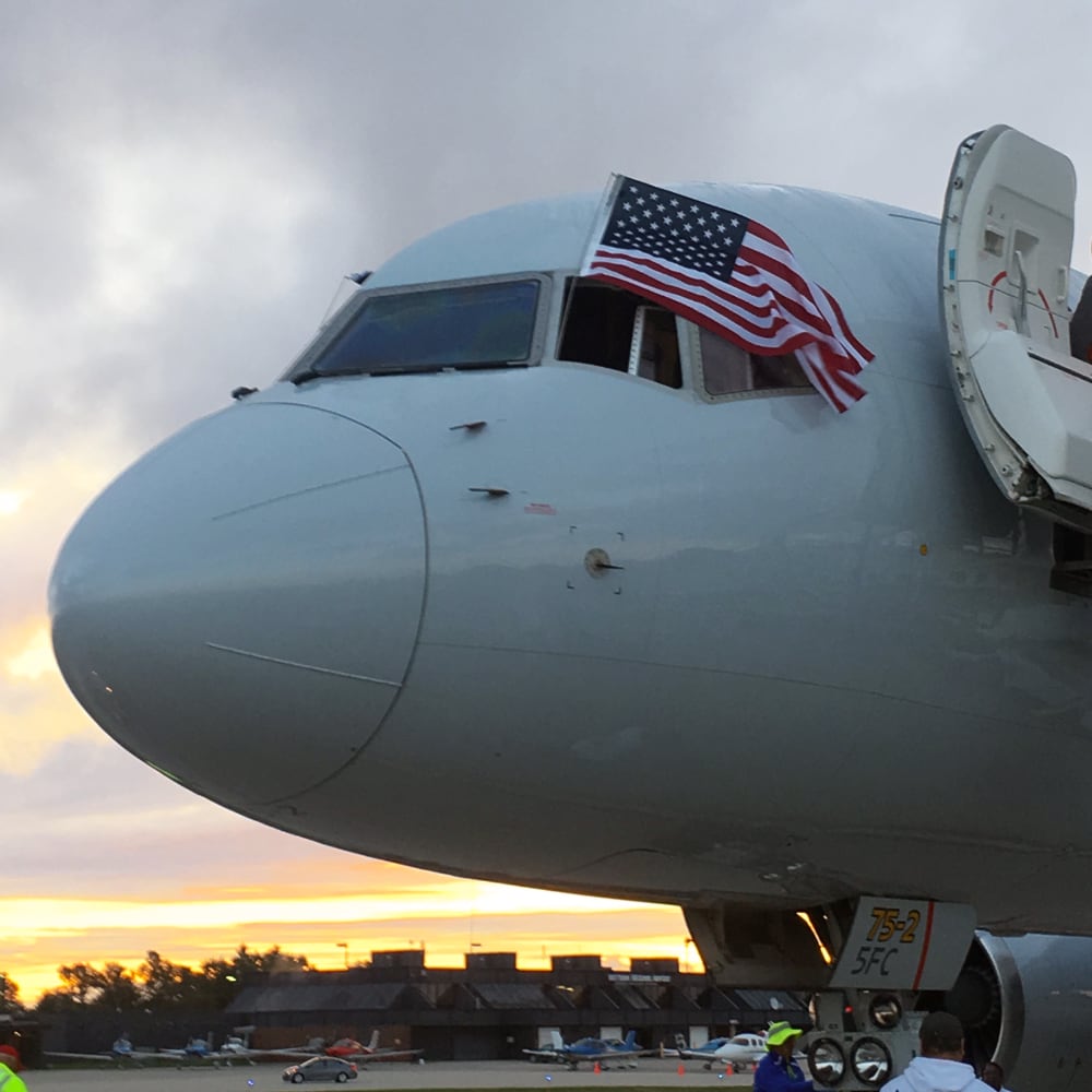 The captain of the 2018 Yellow Ribbon Honor Flight displayed the U.S. flag from the cockpit window