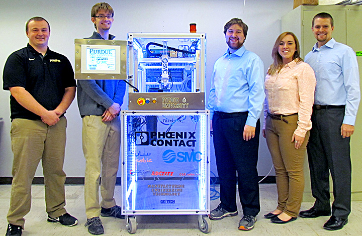 Brandon Bender, Zach Eastman, Brandon Cox, Kaci Kelsey and Ryan Lewis show off their 2015 Xplore Automation entry.