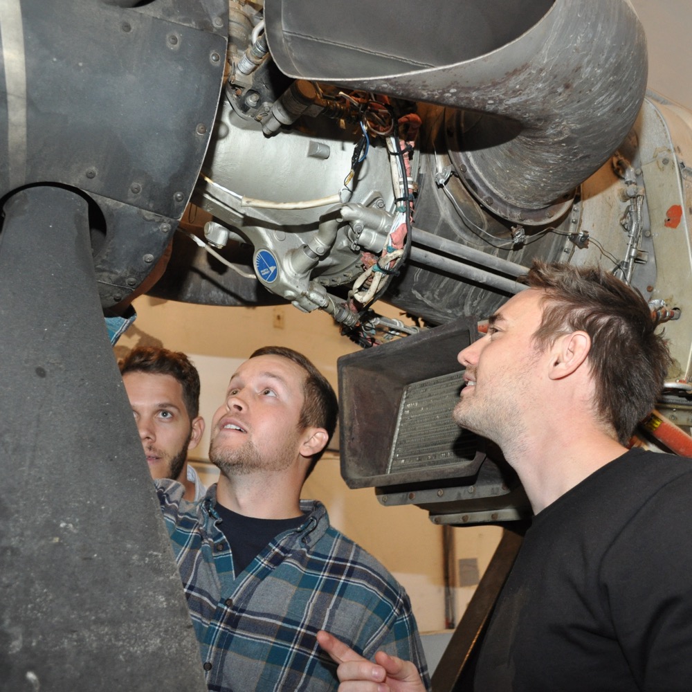 Students examine the Pratt and Whitney PT6 engine
