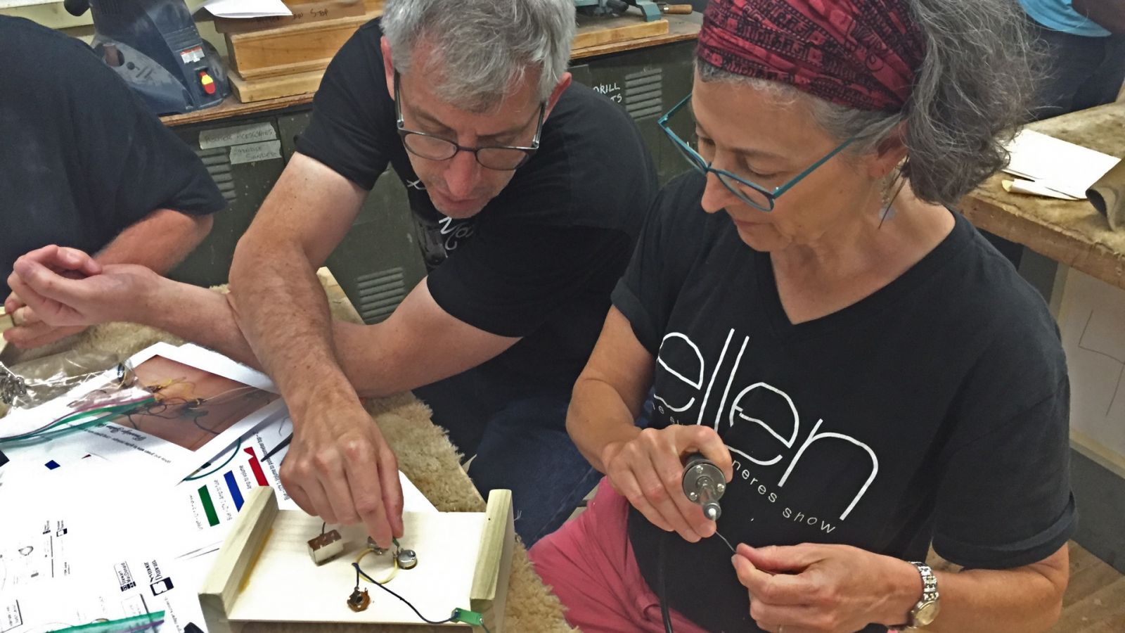 Mark French works on guitar electronics with a Pennsbury High School teacher in Fairless Hills, Pennsylvania