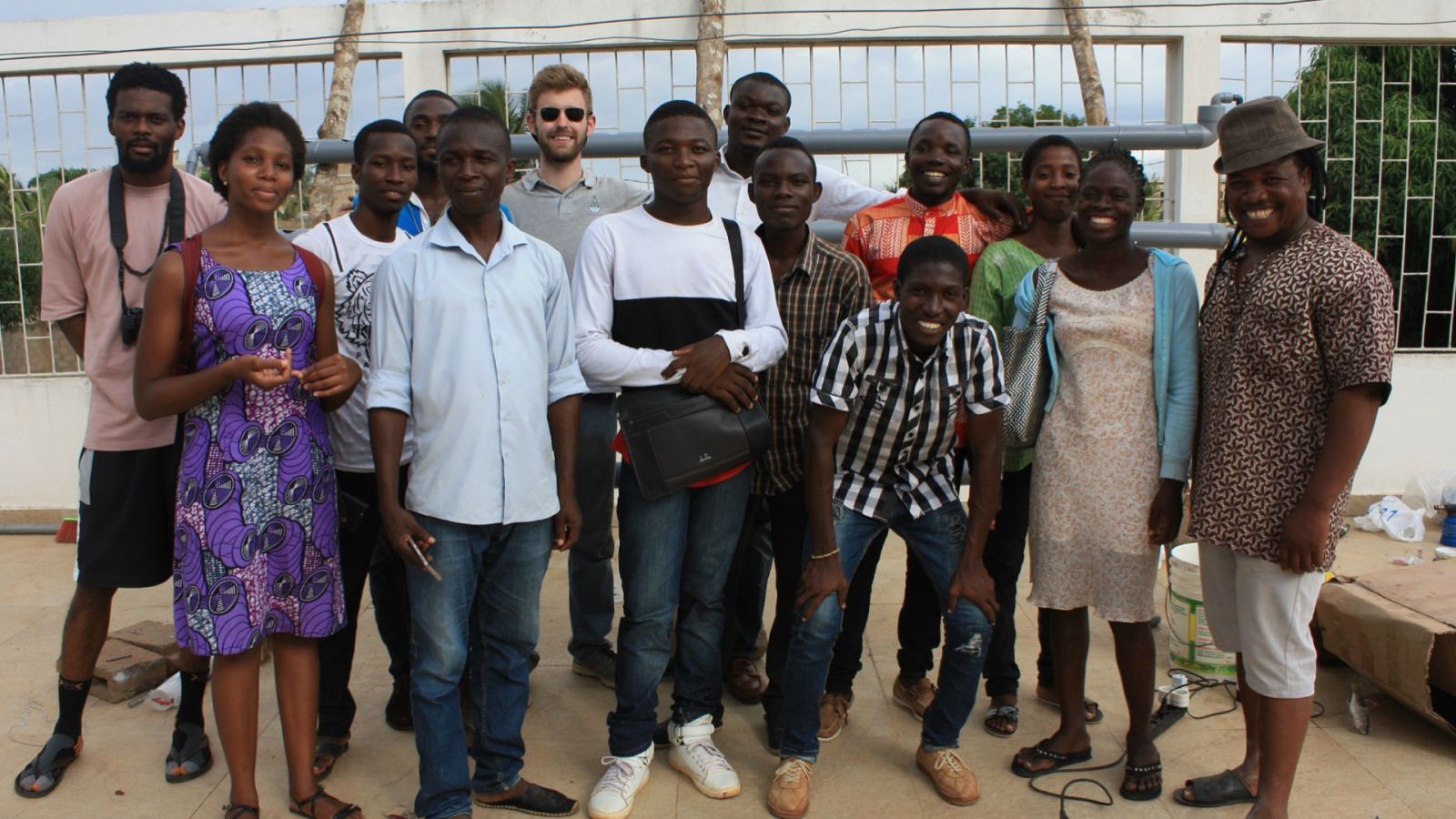 Scott Massey (center, with sunglasses), a founder of Heliponix LLC, poses with residents of Togo who took part in a hands-on workshop on hydroponics in the small West Africa country, where many people survive on subsistence farming. The workshop was funded by the Mandela Washington Fellowship Reciprocal Exchange Component. (Photo provided)