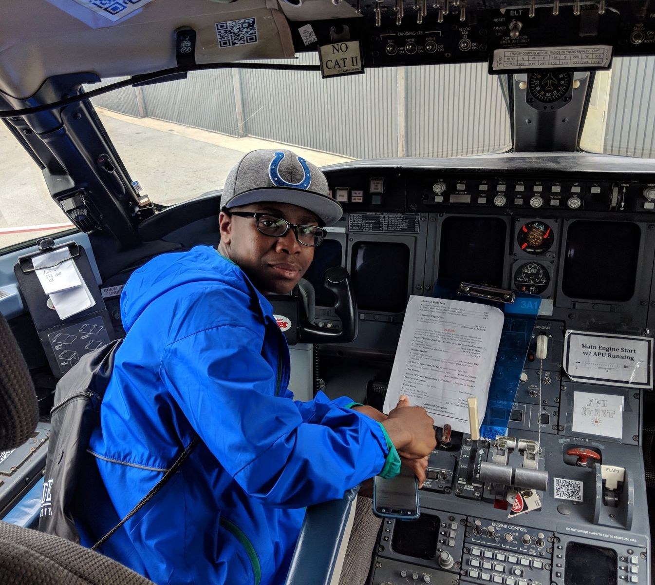 A TOTAL Camp participant tours a Beechjet aircraft cockpit