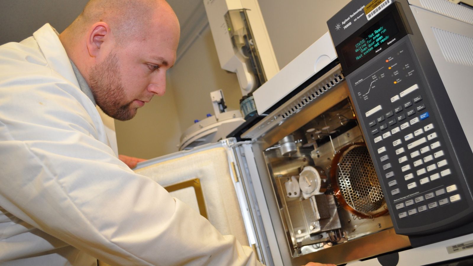 Petr Vozka works with a 2-D gas chromatograph in the FLORE lab