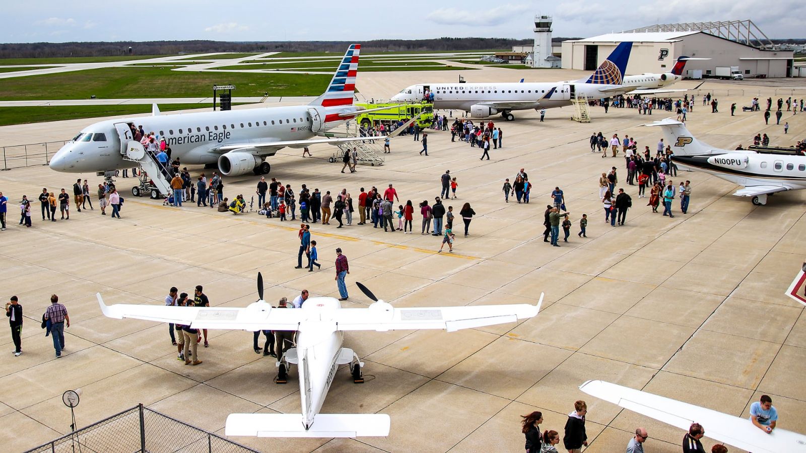 Crowds line up to check out the variety of planes flown in for the 2018 Aviation Day. 