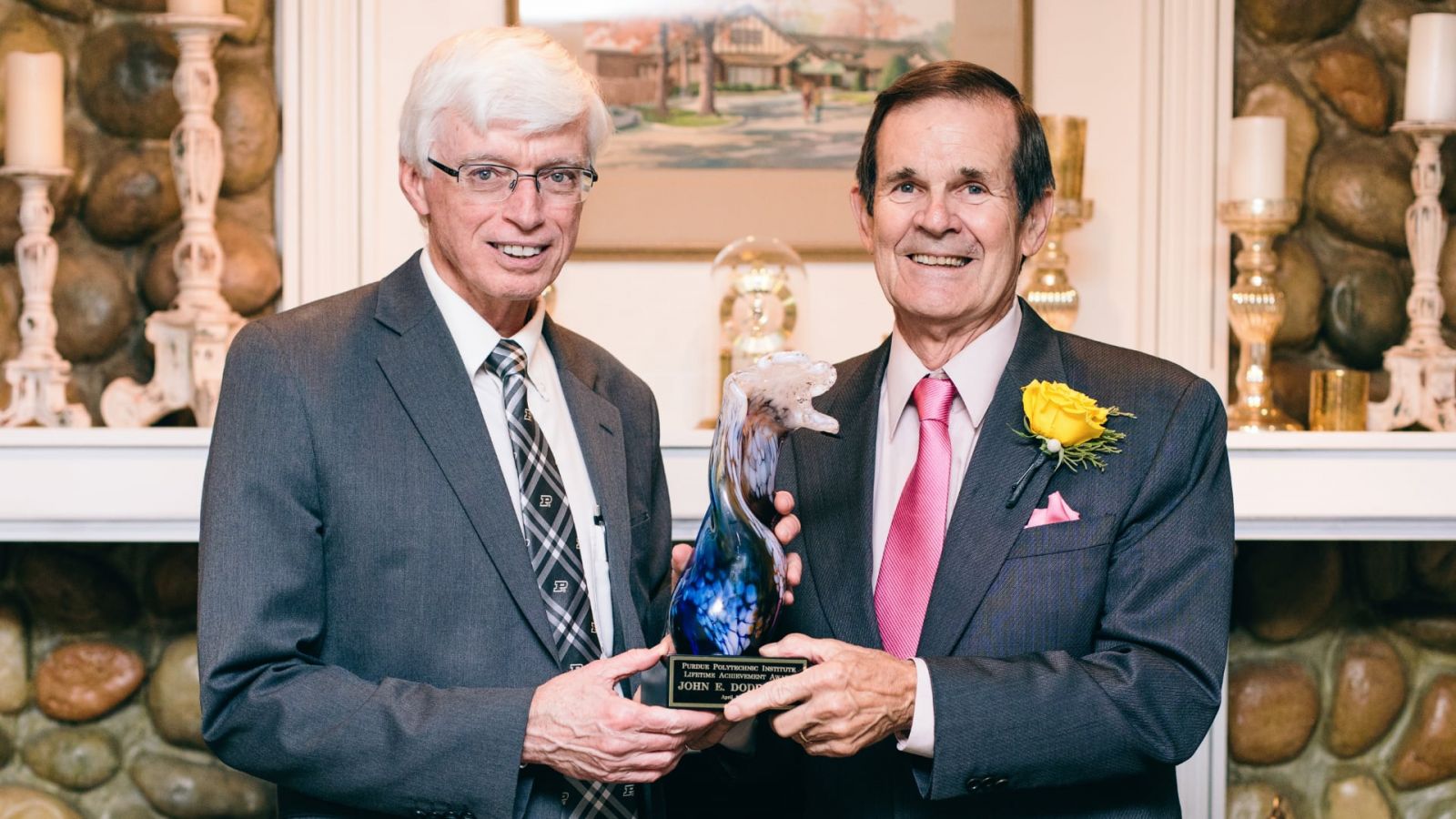 Gary Bertoline, dean of Purdue Polytechnic, presents John Doddridge with the Polytechnic's Lifetime Achievement Award