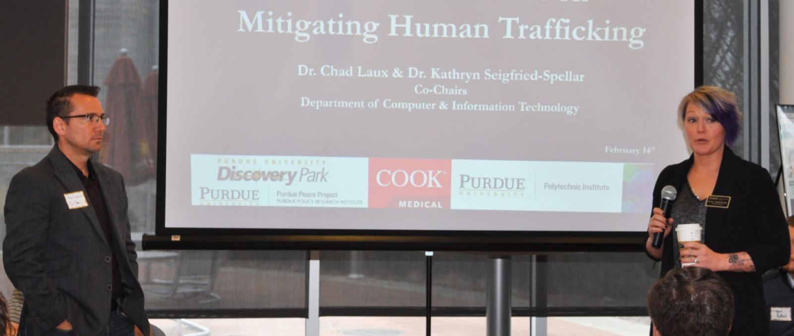 Chad Laux, associate professor of computer and information technology, and Kate Seigfried-Spellar, assistant professor of computer and information technology, introduce the Design Innovation Challenge's awards presentation