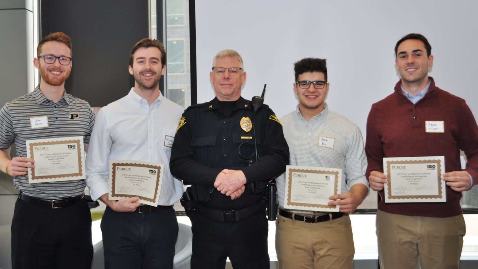 Jon Gaide, graduate student in biomedical engineering; Mickey Smith, senior in biomedical engineering;  John Cox, chief, Purdue University Police Department; Derek Paz, sophomore in exploratory studies; Adam Killeen, senior in biomedical engineering