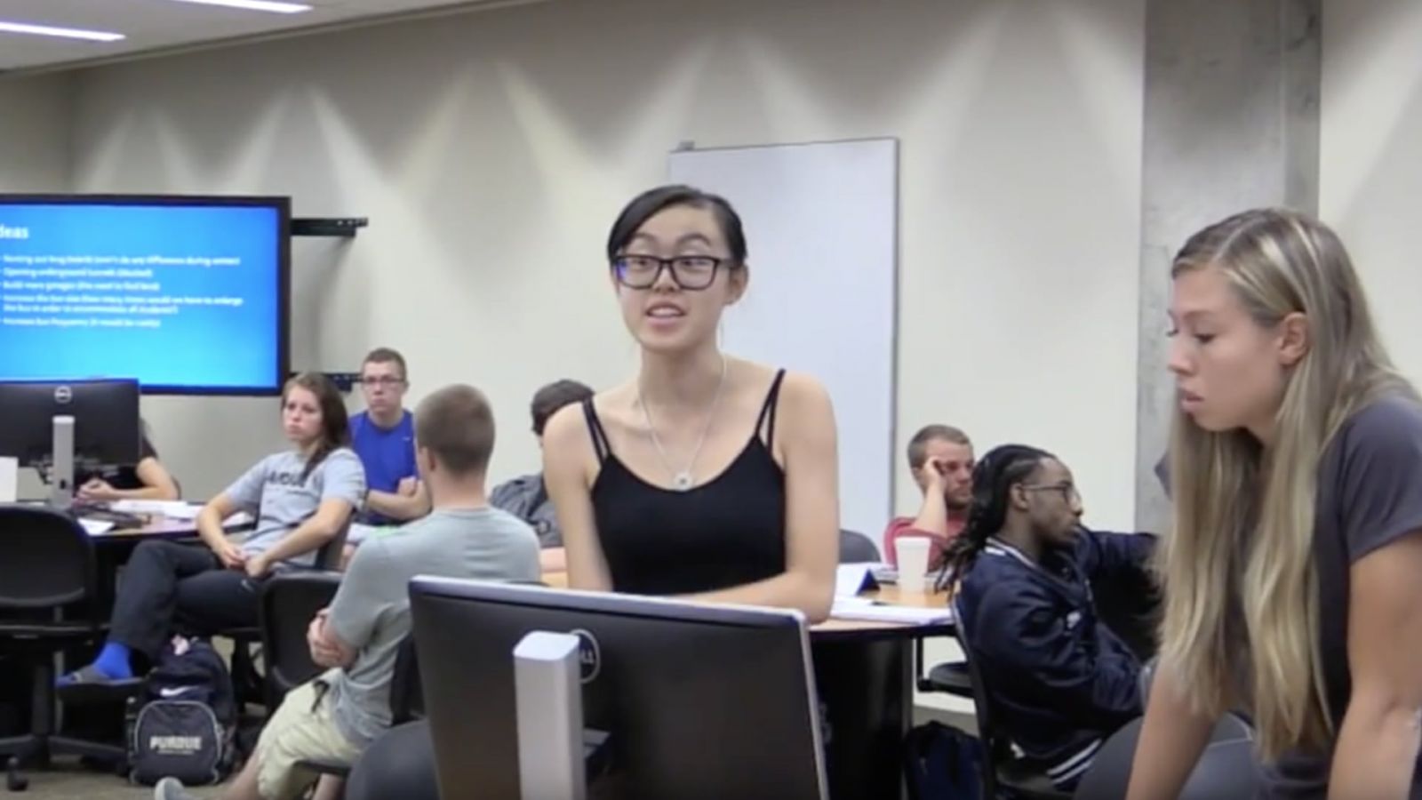 In September 2015, students present a discussion topic in an IMPACT classroom at the Hicks Undergraduate Library
