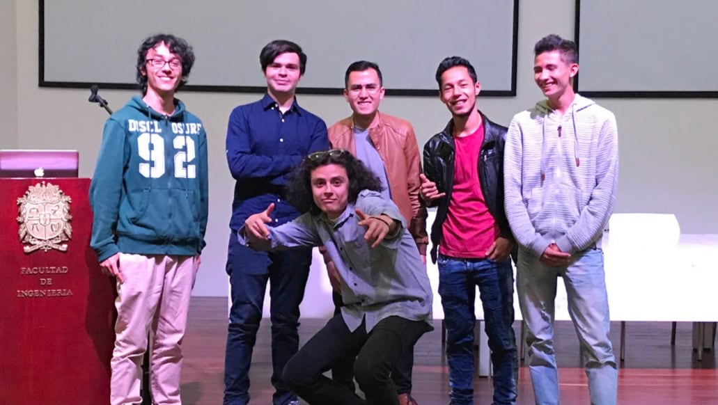 IronHacks staffer Alejandro Vecchio, foreground, with the competition's award winners