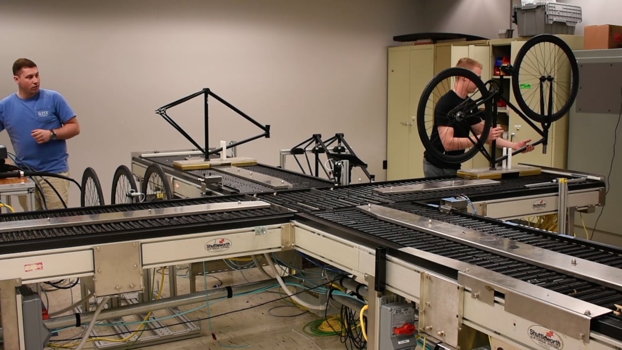 Students work on a prototype of a bicycle manufacturing line