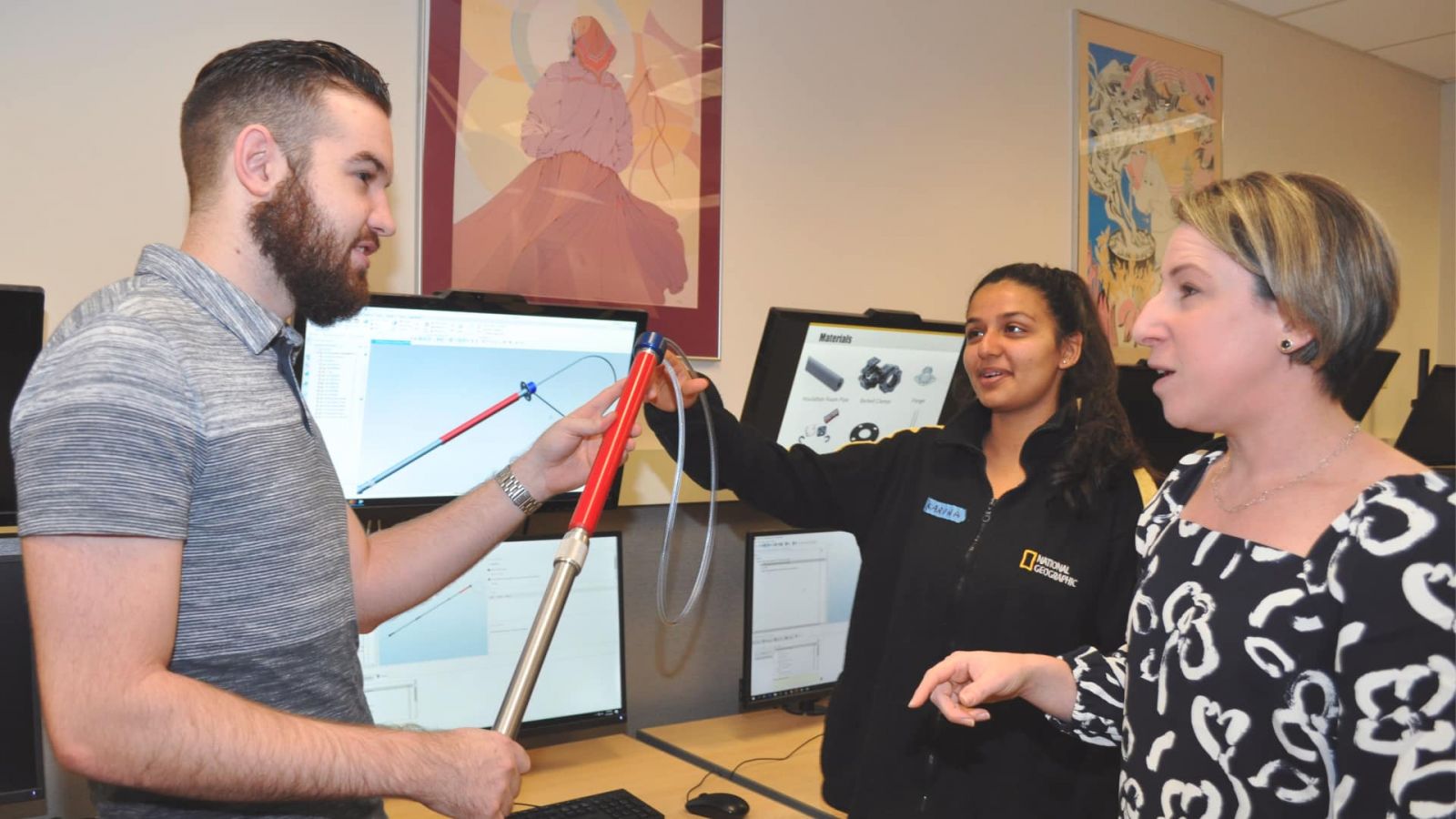 Rosemary Astheimer (right) reviews a project prototype with students. (Purdue University photo/John O’Malley)