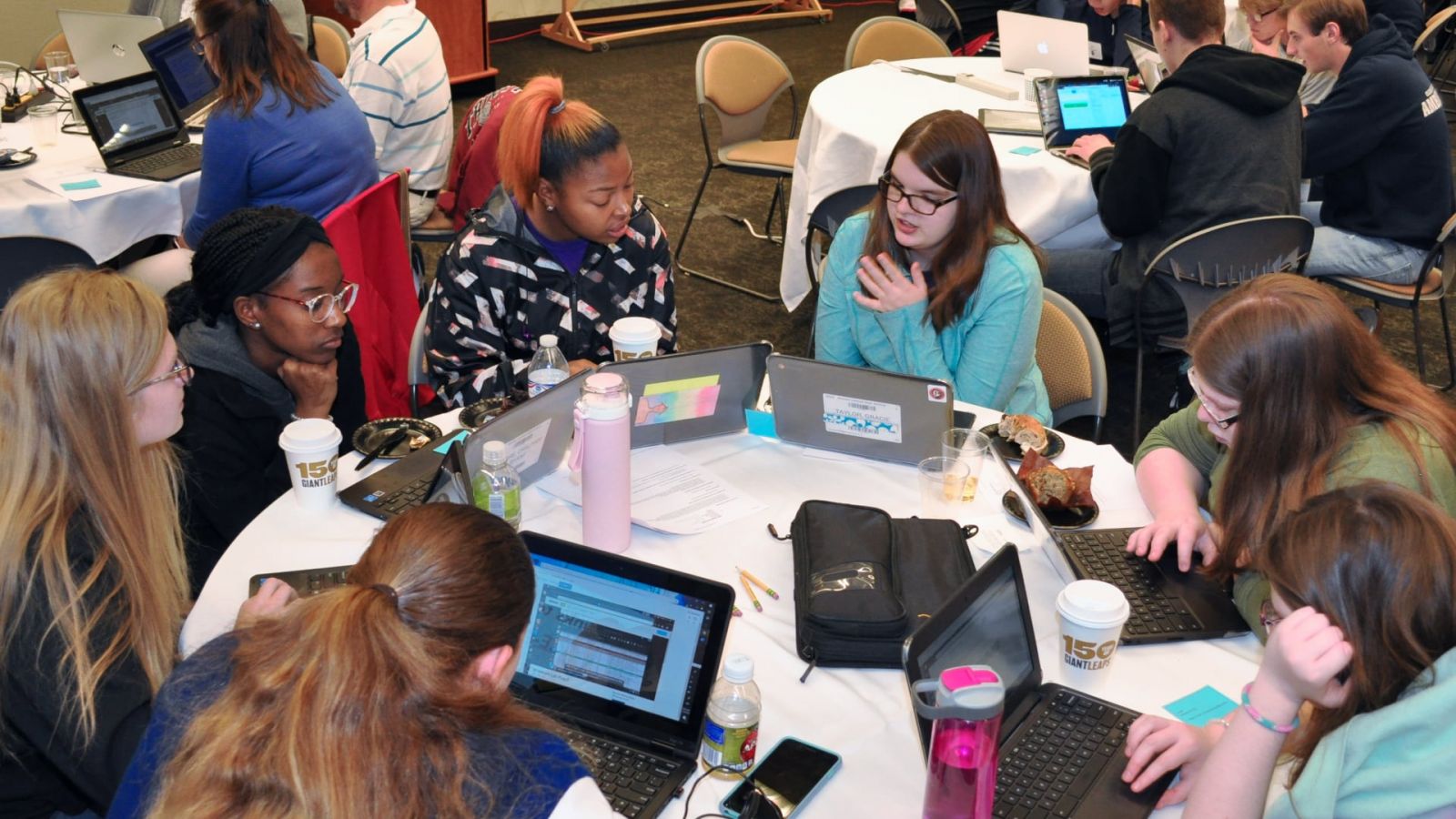 Students work on challenges at the Cyber Encounters workshop