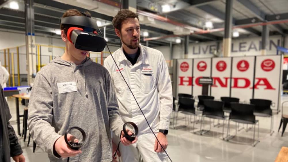 Students from Jobs for America’s Graduates (JAG) Region 9 using virtual reality forklift simulation in the HMIN Drives Dreams Pathway with HMIN’s Brandon Parker.