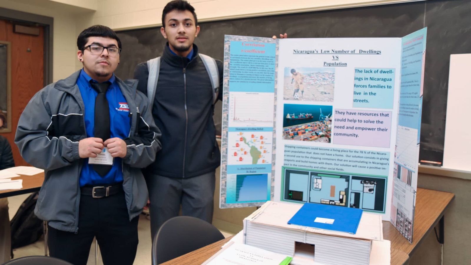 Tomas Santos (left) and Diego González are seniors at Goshen High School in Goshen, Indiana. Their TSA presentation spotlighted the lack of affordable housing in Nicaragua and proposed using excess shipping containers to fill that need.