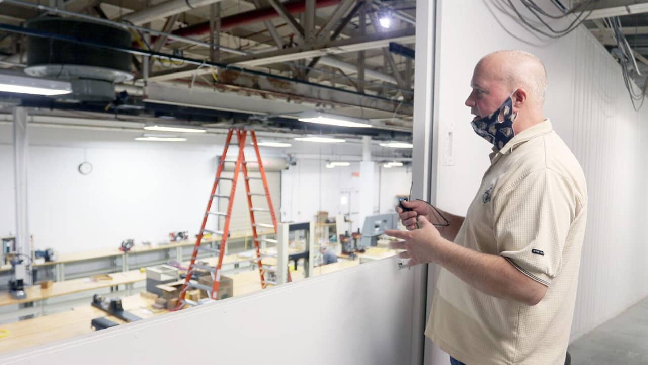 Jeff Griffin, director of Purdue Polytechnic Kokomo, showcases the basement area at Inventrek Technology Park that houses some of the Kokomo location's largest pieces of machinery and student workspaces. (Kokomo Perspective photo/Alyx Arnett)