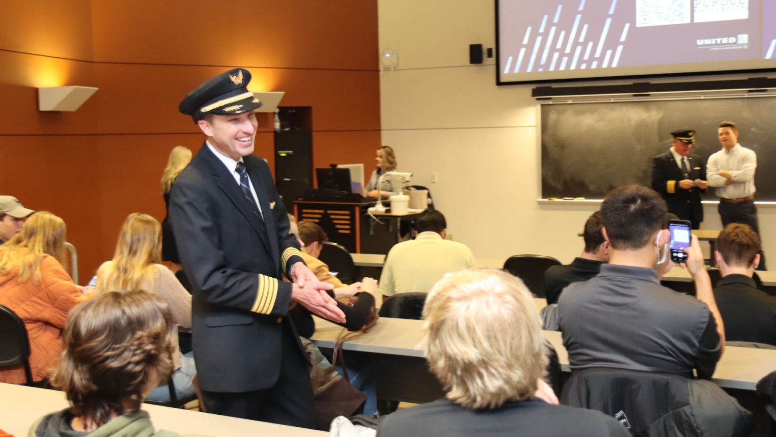 United Airlines Capt. Pete Zabel (BS professional flight 2005) visits with current students during a presentation announcing the United Aviate program’s partnership with Purdue. (Purdue University photo/John O’Malley)