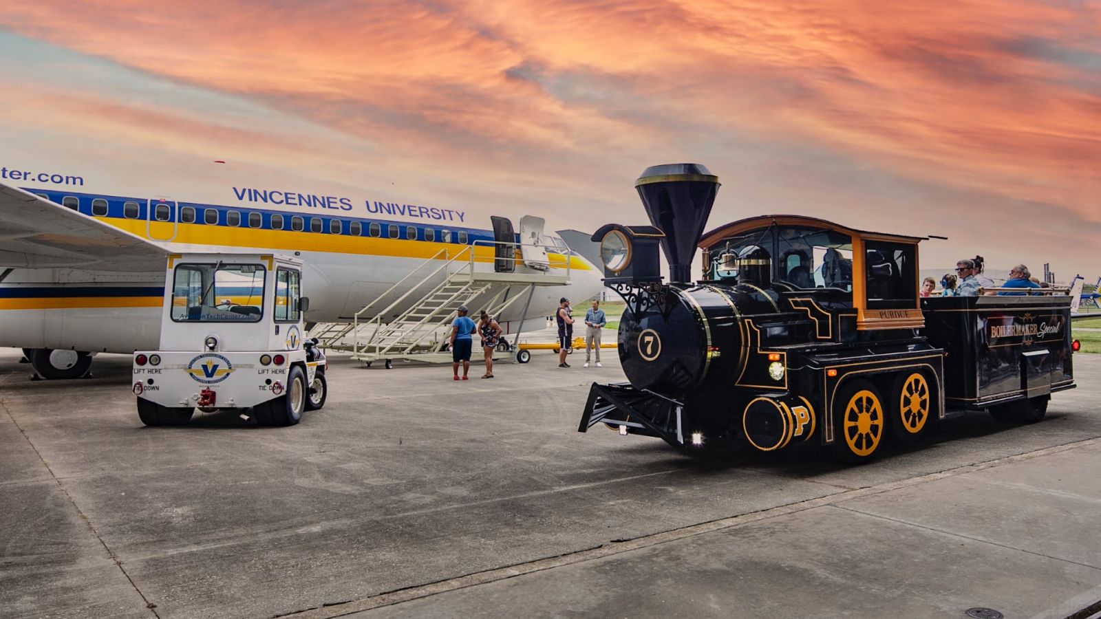 Purdue's Boilermaker Special and a jet aircraft on display at Aviation Community Day in Indianapolis