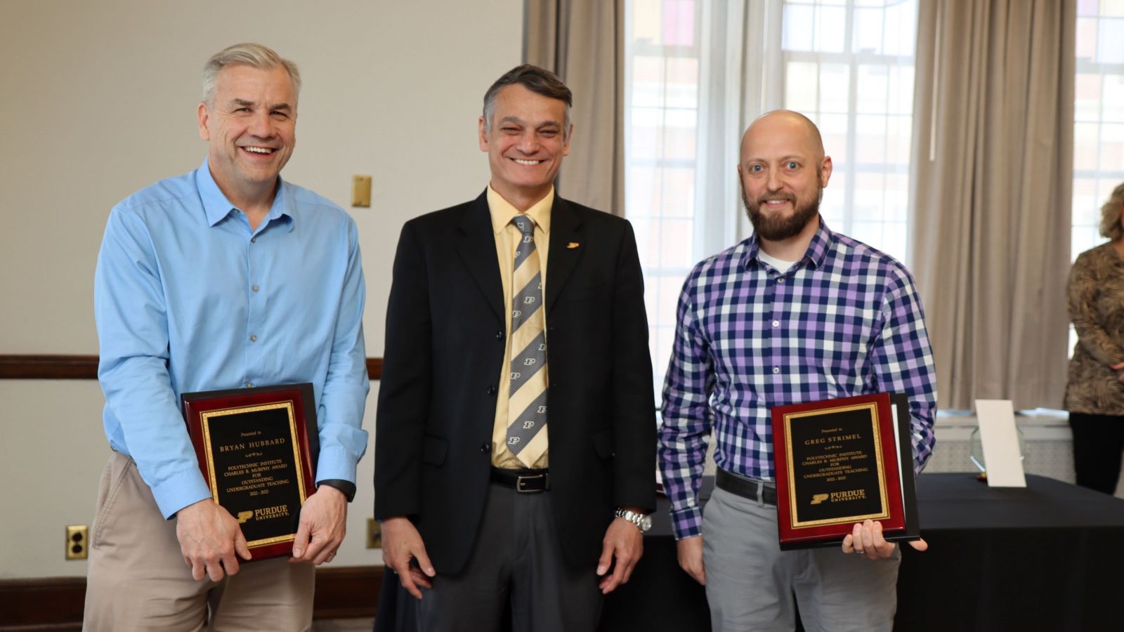 Bryan Hubbard (left) and Greg Strimel, Murphy Award winners, with Castro-Lacouture.  (Purdue University photo/John O'Malley)