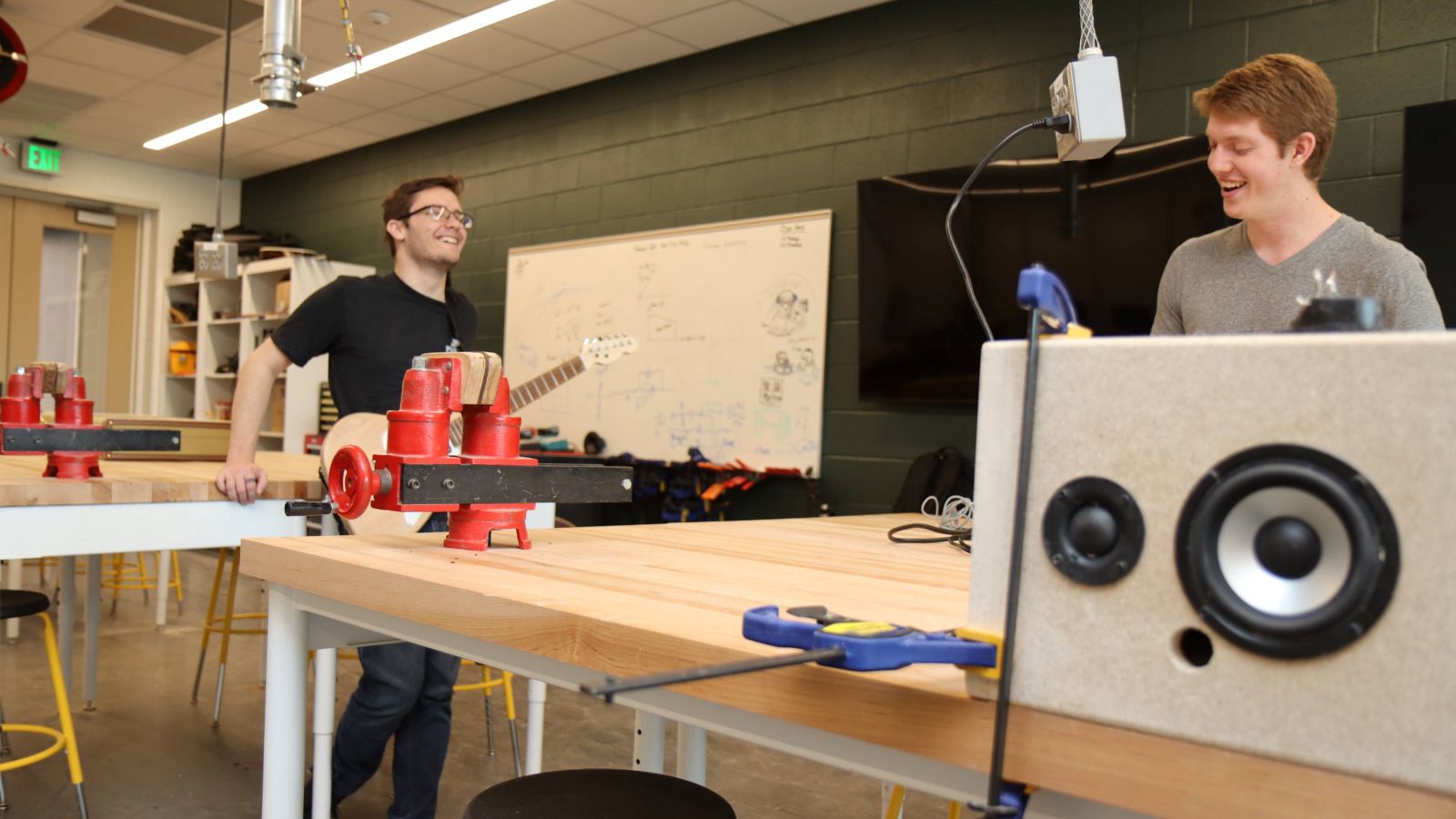 Ethan Fry (left) and Gryphon Mawhorter (right) discuss class experiences in Prof. Mark French's guitar lab.