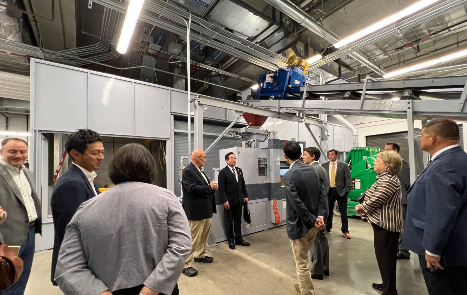 Consul-General Hiroshi Tajima (center-right) tours the Smart Foundry alongside Tim Updike (center-left) of the School of Engineering Technology within Dudley and Lambertus Halls on June 22, 2023. (Purdue University photo/John O'Malley)