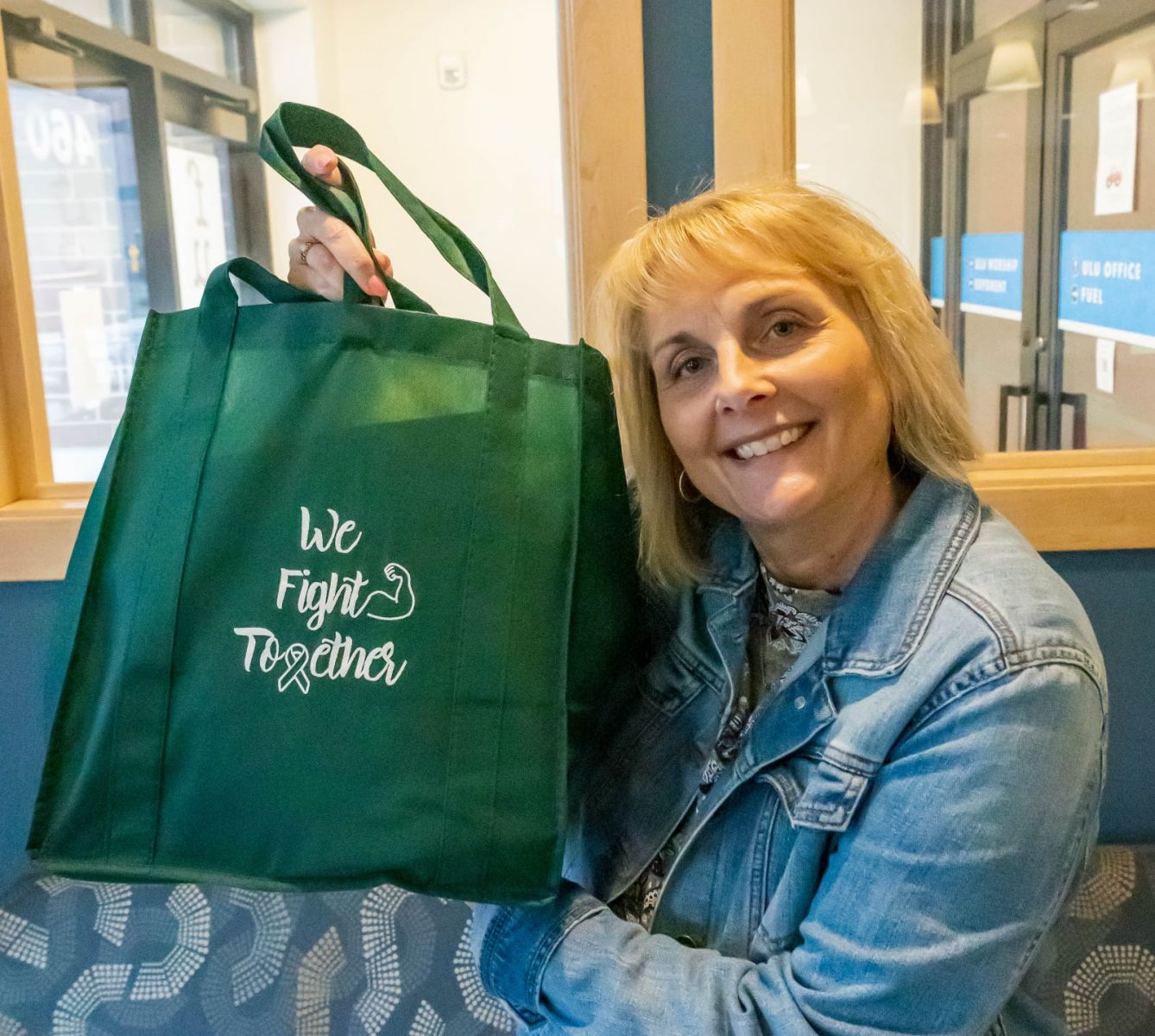 Julie LaGrange holds up a We Fight Together care package (Purdue University photo/Alison Manges)