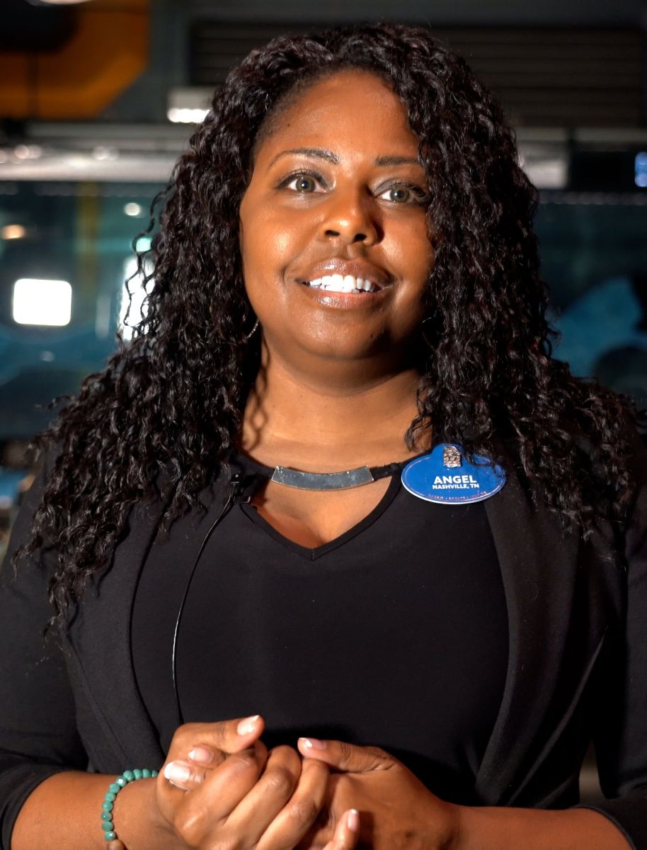 Angel’s blue nametag signals that she received the Walt Disney Legacy Award, the highest honor given to a Disney Parks cast member. (Purdue University photo/Jared Pike) (To download, see Media Kit Resources below.)