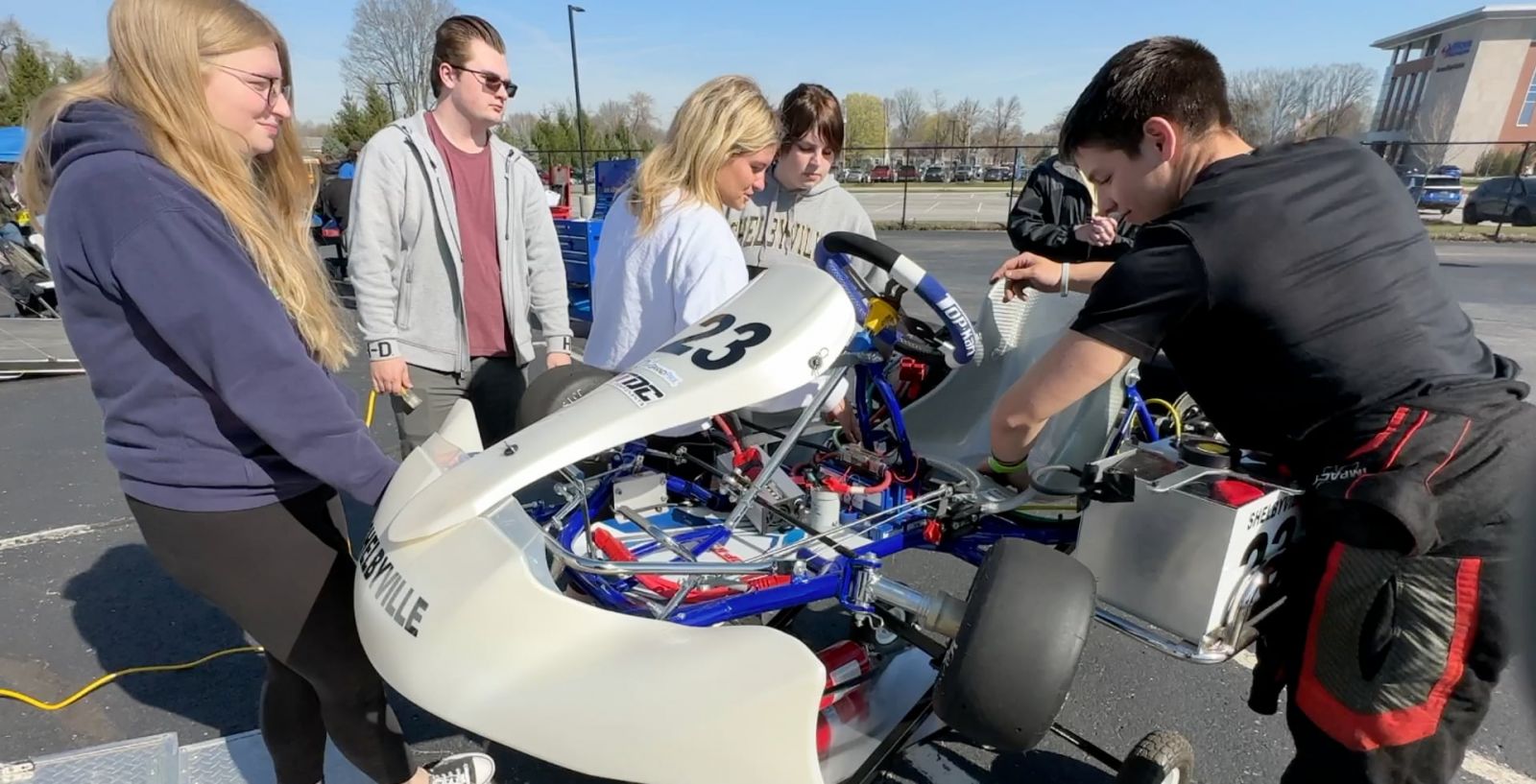 Students from Shellbyville High School's team work on their electric kart. (Purdue University photo/John O'Malley)