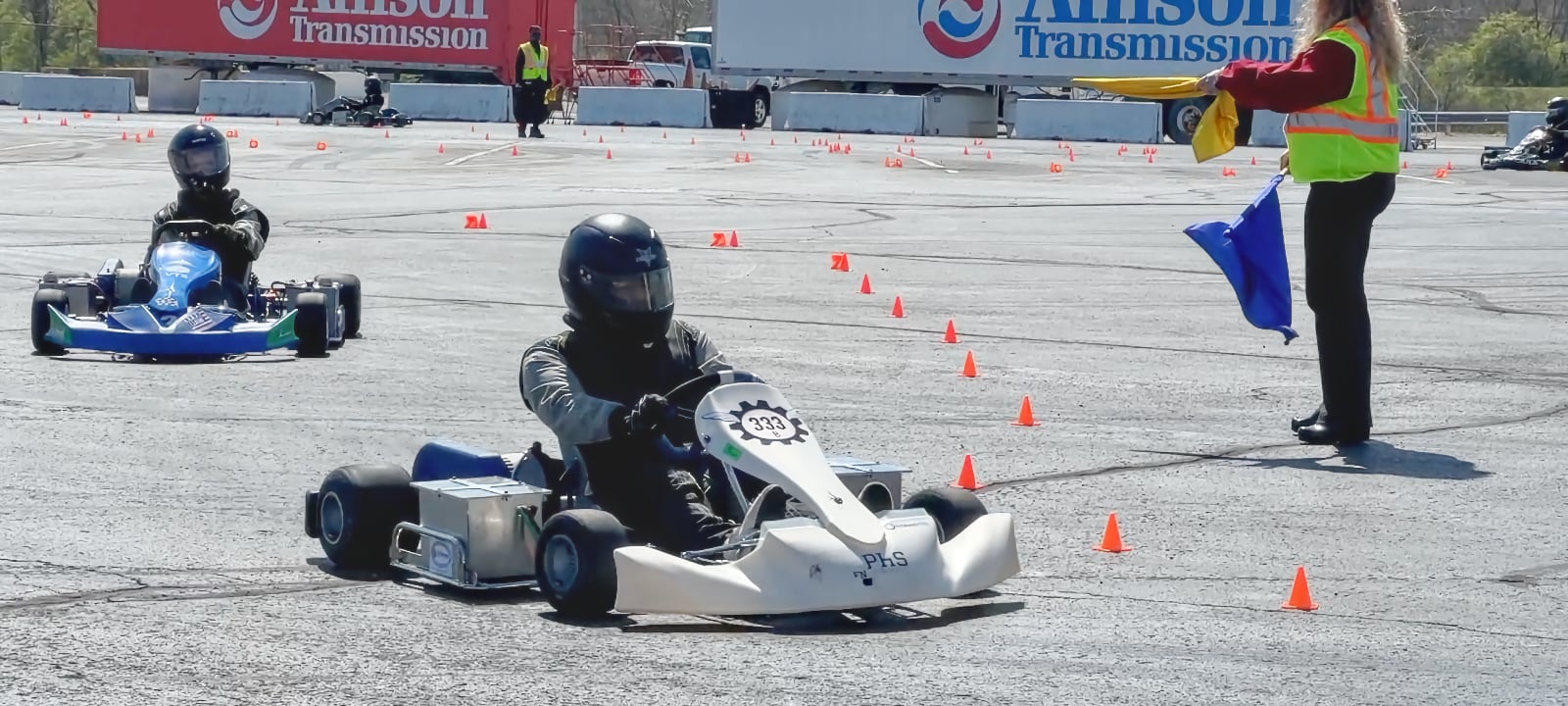 Drivers of three electric go-karts take laps on a course at Allison Transmission in Indianapolis designed to mimic the Purdue Grand Prix track. (Purdue University photo/John O'Malley)