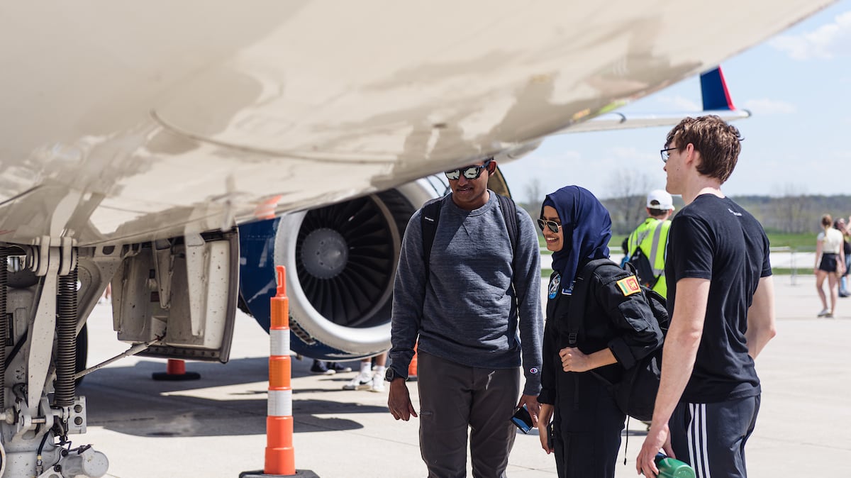 Purdue University students observe the underside of a plane on Purdue Aviation Day 2022 (Photo/Purdue Marketing and Media)